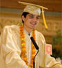 Austin Ayer in cap and gown at the podium