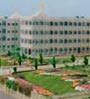 4 storey classical style white building with formal gardens