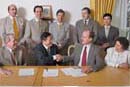 officials of VIBT and MUM shaking hands