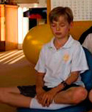 school boy meditating